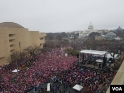 Women's March protesters span across the Mall in Washington D.C., Jan 21. 2017. Hundreds of thousands are attending the protest against the Trump presidency. (Photo: N. Papadogiannakis / VOA)