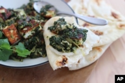 The classic Indian dish saag paneer with cauliflower and spinach is served at a restaurant in New Hampshire.