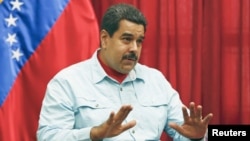 Venezuela's President Nicolas Maduro speaks during a meeting at Miraflores Palace in Caracas, March 26, 2015.