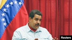 FILE - Venezuela's President Nicolas Maduro speaks during a meeting at Miraflores Palace in Caracas..