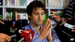 Diego Lagomarsino, an information specialist who gave late prosecutor Alberto Nisman the gun that killed him, speaks to reporters during a press conference in Buenos Aires, Jan. 28, 2015.