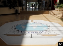 FILE - The Interpol logo is seen inside the Interpol headquarters in Lyon, central France, July 5, 2010.