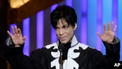 FILE - Prince accepts the award for outstanding male artist at the 38th NAACP Image Awards in Los Angeles, March 2, 2007.