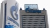 FILE - A general view shows the headquarters of Gazprom, with a board of Gazprom Neft, the oil arm of Gazprom seen in the foreground, on the day of the annual general meeting of the company's shareholders in Moscow. 