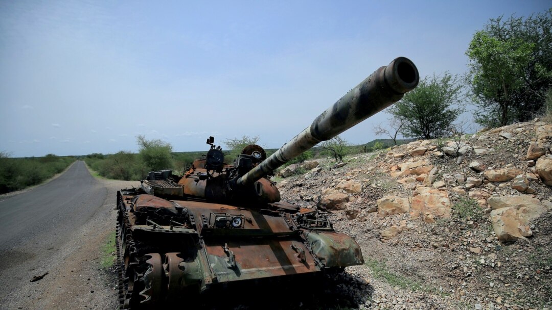 FILE - A tank damaged during the fighting between Ethiopia's National Defense Force (ENDF) and Tigray Special Forces stands on the outskirts of Humera town in Ethiopia July 1, 2021.