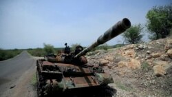 FILE - A tank damaged during the fighting between Ethiopia's National Defense Force (ENDF) and Tigray Special Forces stands on the outskirts of Humera town in Ethiopia July 1, 2021.