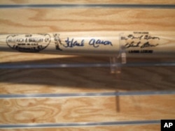 Master copies of the company's more famous bats are kept in a special vault. This slugger is signed by baseball great Hank Aaron.