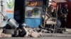 National police take cover as gunshots ring out at the end of a ceremony marking the 212th anniversary of the assassination of independence hero Gen. Jean-Jacques Dessalines in Port-au-Prince, Haiti, Oct. 17, 2018. 