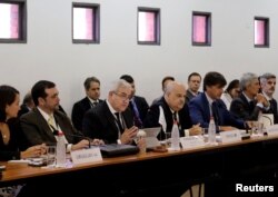 FILE - Negotiators of the Latin American bloc Mercosur and the European Union (not pictured) meet to continue discussions on a free trade deal, in Luque, Paraguay, Feb. 21, 2018.