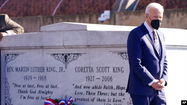 President Joe Biden walks away after a wreath laying at the tomb of the Rev. Martin Luther King Jr., and his wife, Coretta Scott King, Jan. 11, 2022, in Atlanta, Georgia.