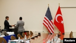 FILE - A U.S. and a Turkish flag are seen ahead of the start of a meeting between American and Turkish officials in Brussels, Belgium, Dec. 20, 2015. Thursday's bilateral talks will be held in Washington.