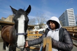 Zion Mcleod, 13, spends time with Eddie at the club.