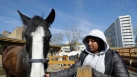 Zion Mcleod, 13, spends time with Eddie at the club.