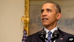 President Barack Obama speaks about the Paris climate agreement from the Cabinet Room of the White House in Washington, Dec. 12, 2015.