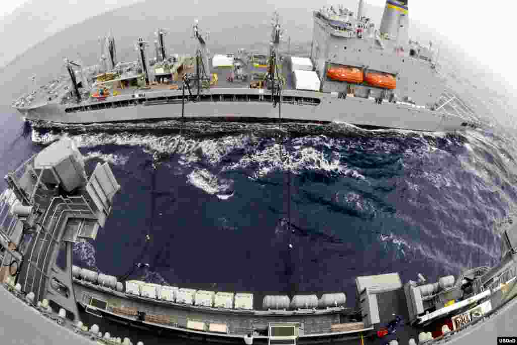 Military Sealift Command fleet replenishment oiler Henry J. Kaiser (T-AO 187) steams alongside the aircraft carrier USS Ronald Reagan during a replenishment-at-sea, May 8, 2013. (U.S. Navy photo by MCS 3rd Class Terry Godette)