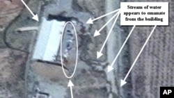 This April 9, 2012 photo provided by the Institute for Science and International Security, ISIS shows suspected cleanup activities at a building alleged to contain a high explosive chamber used for nuclear weapon related tests in the Parchin military comp