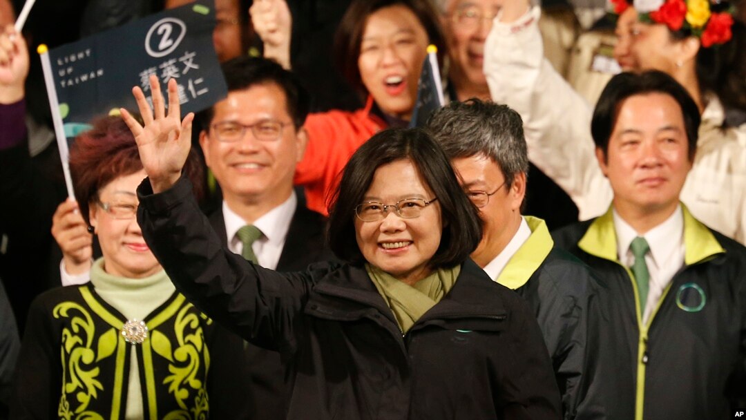Taiwan's Democratic Progressive Party, DPP, presidential candidate, Tsai Ing-wen, raises her hands as she declares victory in the presidential election Saturday, Jan. 16, 2016, in Taipei, Taiwan.