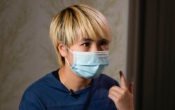 Wu Huan saat diwawancarai di lokasi yang aman di Ukraina, 30 Juni 2021. (AP)