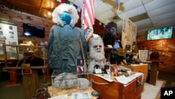 FILE - This Aug. 8, 2019, photo shows items donated by the family of Yeti researcher Tom Slick on display at Expedition: Bigfoot! The Sasquatch Museum in Cherry Log, Georgia. (AP Photo/John Bazemore)