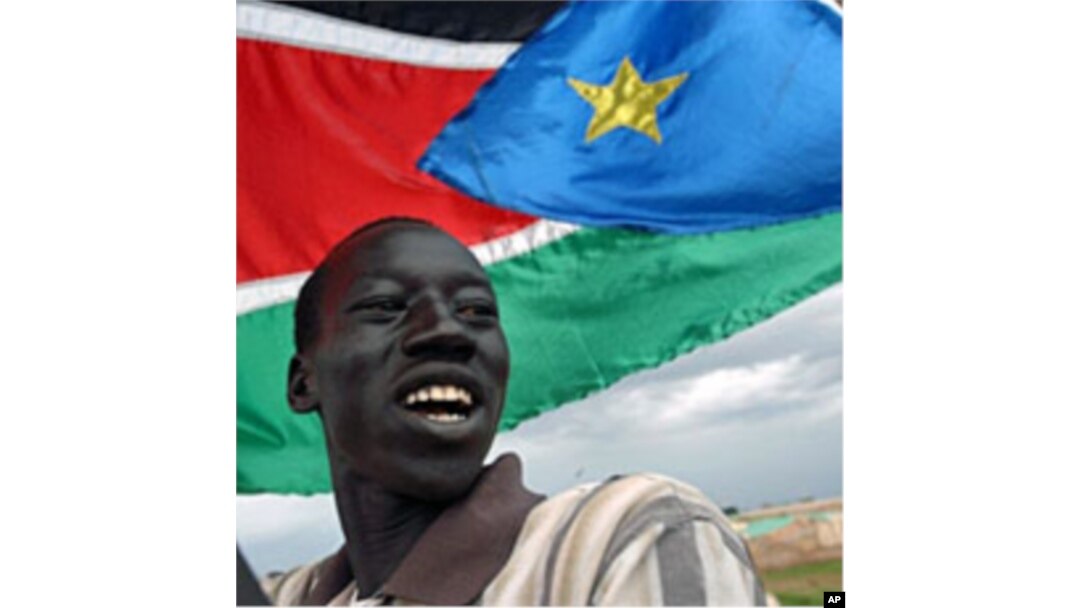 A resident of Abyei marches with the Southern Sudan flag (File)