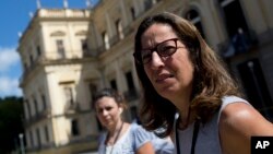 Deputy Director of Brazil's National Museum Cristiana Serejo talks with the media outside the museum that suffered a fire in Rio de Janeiro, Sept. 5, 2018. 