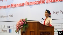 Myanmar's State Counselor Aung San Suu Kyi delivers an opening speech during the Forum on Myanmar Democratic Transition at Myanmar International Convention Center in Naypyitaw, Myanmar, Aug 11, 2017.