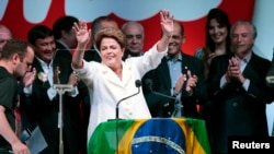 Brazil's President and Workers' Party (PT) presidential candidate Dilma Rousseff reacts during a news conference to the election results, in Brasilia Oct. 26, 2014.