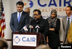 Farhan Khan (C), brother-in-law of San Bernardino shooting suspect Syed Farook, speaks at the Council on American-Islamic Relations during a news conference in Anaheim, California, Dec. 2, 2015.