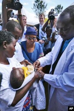 A doctor immunizes a baby