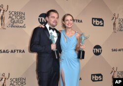 Leonardo DiCaprio, left, winner of the award for outstanding male actor in a leading role for “The Revenant” and Brie Larson winner of the award for outstanding female actress in a leading role for “Room”, pose in the press room at the 22nd annual Screen Actors Guild Awards at the Shrine Auditorium & Expo Hall, Jan. 30, 2016, in Los Angeles.