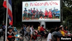 A board showing "Welcome home, boys", is seen after rescue effort has begun for the 12 schoolboys and their soccer coach trapped in Tham Luang cave, in Chiang Rai, Thailand, July 9, 2018.