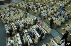 FILE - Russian lawmakers attend a session of the lower house of the State Duma in Moscow, Russia, July 6, 2012.