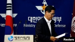 FILE - South Korea's Defense Ministry spokesman Kim Min-seok leaves after a briefing at the Defense Ministry in Seoul.