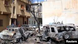 Vehicles damaged by overnight shelling are seen in Abu Salim district, Tripoli, Libya, April 17, 2019. 