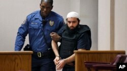 FILE - Ahmad Khan Rahimi, the man linked to planting two bombs in New York and New Jersey, is led into court in Elizabeth, New Jersey, Dec. 20, 2016.