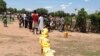 South Sudanese wait to fill a long line of jerry cans at a borehole in the Ocea sector of Rhino refugee resettlement camp in Uganda. 