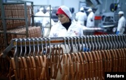 Workers make sausages at Akova Impex Meat Industry Ovako, which makes halal quality certified products, in Sarajevo, Bosnia and Herzegovina, Dec. 2, 2016.