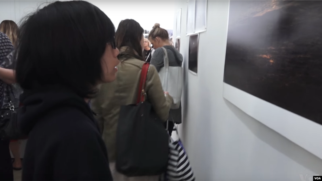 Bayu Lukman admiring one of his photos on display at the Pablove Shutterbugs program photo gallery.