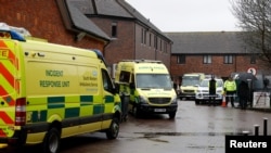 Emergency vehicles behind pub visited by former Russian intelligence officer Sergei Skripal and his daughter Yulia before they found poisoned, Salisbury, Britain, March 28, 2018.