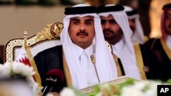 Qatar's Emir Sheikh Tamim bin Hamad al-Thani attends a Gulf Cooperation Council summit in Doha, Qatar, Dec. 9, 2014.