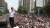 Pemimpin oposisi Juan Guaido menunjukkan rasa terima kasih kepada para pendukungnya dalam rapat umum di Caracas, Venezuela, Rabu, 1 Mei 2019.