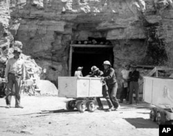 FILE - Diné (Navajo) miners work at the Kerr McGee uranium mine at Cove on the Navajo reservation in Arizona, May 7, 1953. (AP Photo)