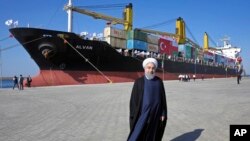 FILE - Iranian President Hassan Rouhani poses at a newly built extension of the port of Chabahar, near the Pakistan border.