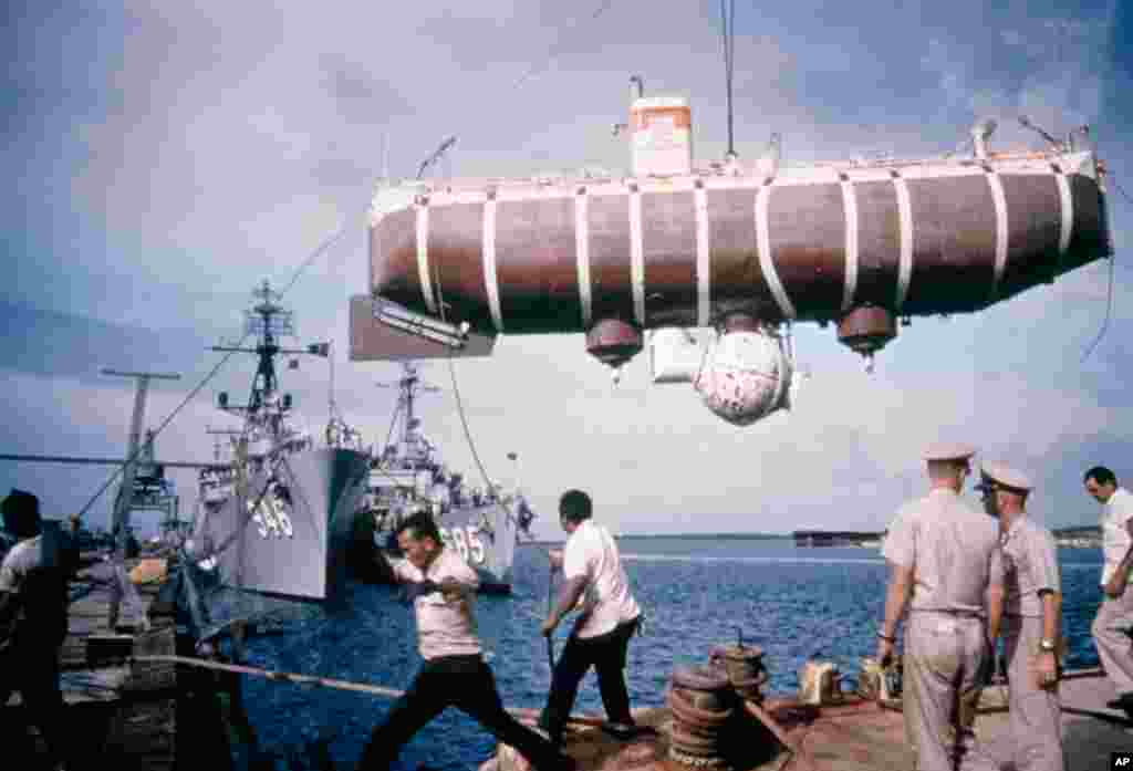 Swinging above the docks in Guam’s Apra Harbor is the Trieste, the submersible that took Don Walsh and Jacques Piccard on the first and only successful manned dive to the bottom of the Mariana Trench. (Photo: Thomas J. Abercrombie)