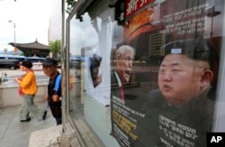 A South Korean news magazine with front cover photos of U.S. President Donald Trump and North Korean leader Kim Jong Un, right, and a headline "Korean Peninsula Crisis" is displayed at the Dong-A Ilbo building in Seoul, South Korea, Sept. 11, 2017.