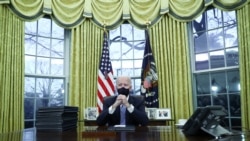 U.S. President Joe Biden signs executive orders in the Oval Office