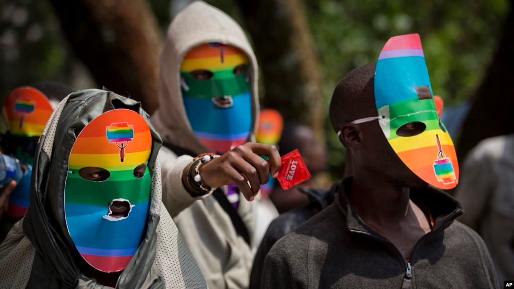 FILE - Kenya gay and lesbian activists conceal their identity behind masks to protest a wave of laws against homosexuality in African countries, Feb. 10, 2014. 