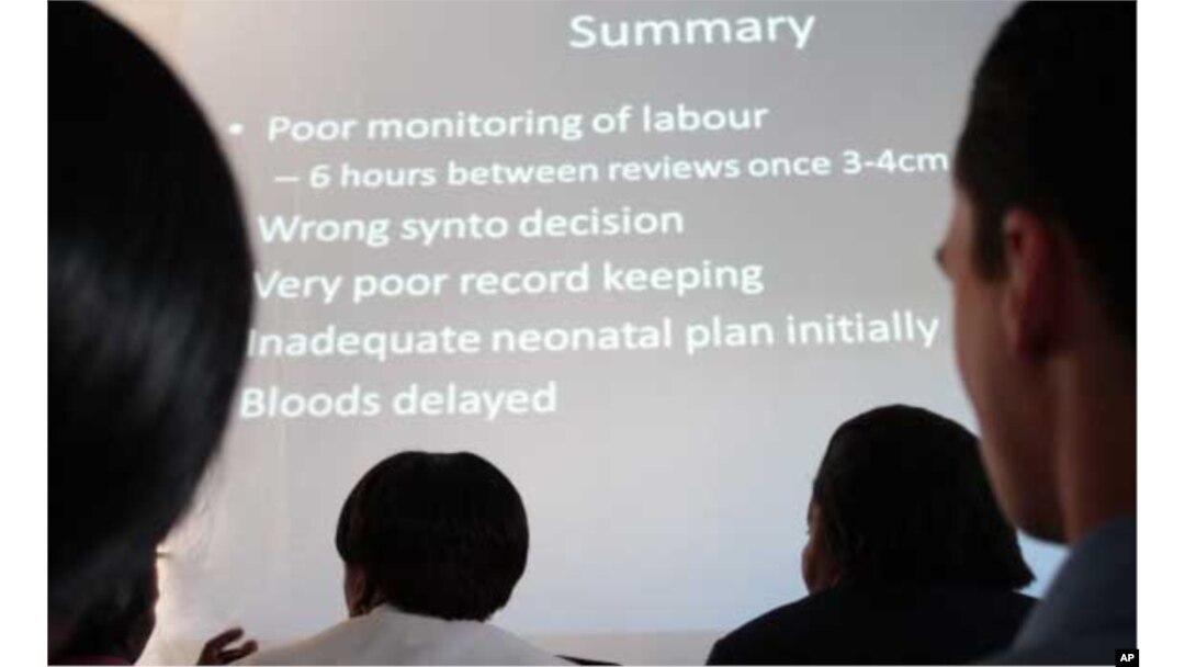 Clinical staff at a hospital in South Africa analyze problems at their facility during a meeting