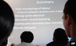 Clinical staff at a hospital in South Africa analyze problems at their facility during a meeting