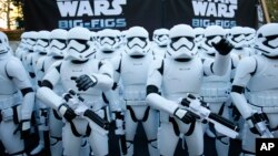 Over 100 JAKKS BIG-FIGS Stormtrooper action figures are seen as a part of an installation at The Americana at Brand for the opening of "Star Wars: The Force Awakens," in Glendale, Calif., Dec. 17, 2015, in Glendale, Calif. (Danny Moloshok/Invision for JAKKS/AP Images) 